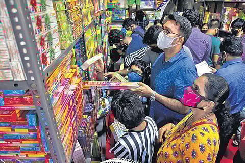 With Deepavali around the corner, people across the State have begun shopping for crackers. A scene at a shop on Island Grounds in Chennai | Martin Louis