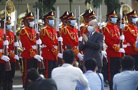 Cambodia's King Norodom Sihamoni, center, reviews the honorary troop during the country's 67th Independence Day celebration, in Phnom Penh, Cambodia, Monday. (Photo | AP)