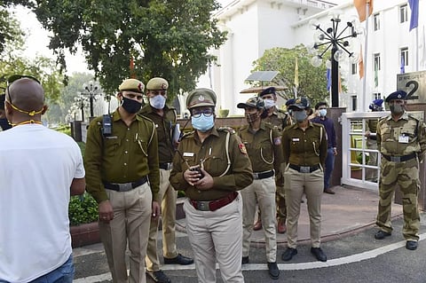 Police stand guard as leaders of various farmer organisations arrive at Vigyan Bhawan after the Centre invited them to hold talks over the new farm reform laws. (Photo | PTI)