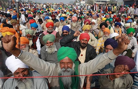 Farmers shout slogans during their ongoing Delhi Chalo protest against Centre's new farm laws at Singhu border on Tuesday. (Photo | Shekhar Yadav, EPS)