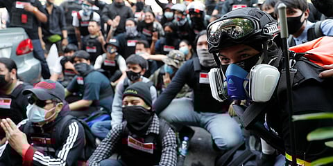 Protesters in charge of security for a pro-democracy rally pose for a group photo in Bangkok. (File photo| AP)