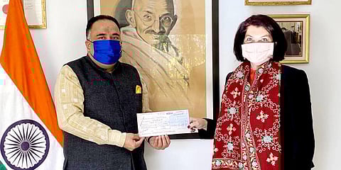 India's representative in Palestine Sunil Kumar presents USD 2 million to the United Nations Relief and Works Agency for Palestine Refugees in the Near East. (Photo| Twitter/ @ROIRamallah)