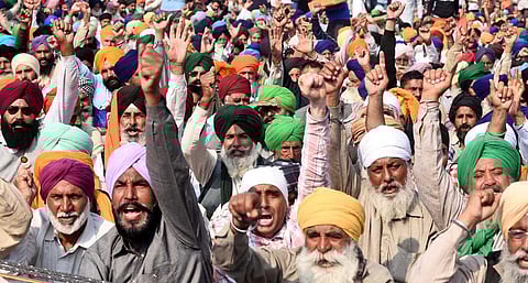 Farmers raise slogans at the Singhu border during 'Delhi Chalo' protest against the new farm laws, in New Delhi. (Photo | Parveen Negi, EPS)