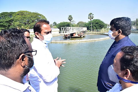 Deputy Chief Minister (Health) Alla Kali Krishna Srinivas (Nani) inspects Pampula Cheruvu in Eluru on Wednesday. (Photo | EPS)