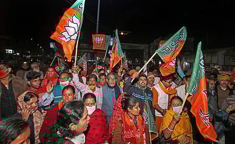 BJP workers block Santiniketan road during their protest condemning the attack on BJP National President JP Nadda's convoy. (Photo | PTI)
