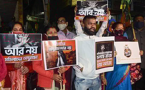 BJP workers stage a protest condemning the attack on BJP National President JP Nadda's convoy during his visit to Diamond Harbour in Siliguri Thursday Dec. 10 2020. (Photo | PTI)