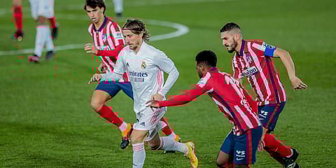 Real Madrid's Luka Modric (C) fights for the ball with Atletico Madrid's Thomas Lemar (2nd from right) during a La Liga soccer match. (Photo| AP)