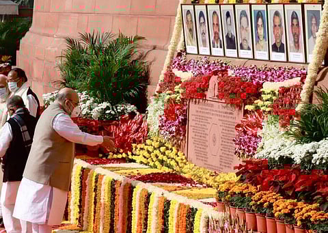 The home minister visited the Parliament complex and paid floral tributes to the portraits of those who were killed. (Photo | Amit Shah, Twitter)
