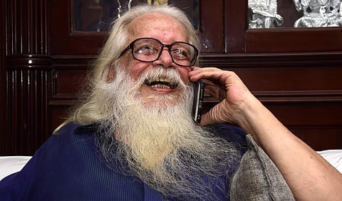 Former ISRO scientist Nambi Narayanan checking his phone on 14 September 2018 after the Supreme court verdict ordering compensation for him for being falsely accused in the ISRO spy case. | BP Deepu
