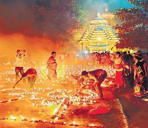 Celebrating Cabinet approval to the Ordinance, servitors light 10,000 lamps at Lingaraj temple on Monday. (Photo | EPS/Shiba prasad Sahu)