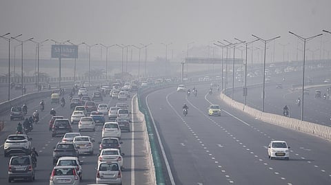 Vehicles seen moving through thick smog in New Delhi.