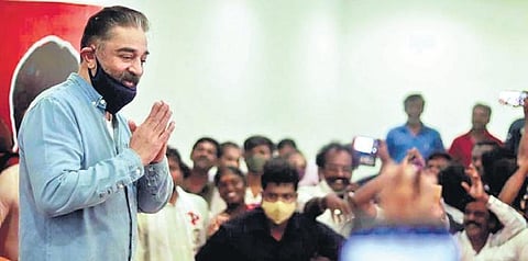 Makkal Needhi Maiam founder Kamal Haasan interacting with cracker manufacturers near Sivakasi on Tuesday | Express