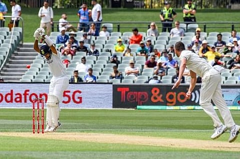 Indian batsman Cheteshwar Pujara avoids a ball on day one of the first cricket Test match between Australia and India in Adelaide (Photo | AFP)