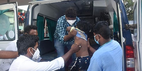 Medical staff shifting a boy who is suffering from mystery illness at government hospital in Eluru. (File photo| P Ravindra Babu, EPS)