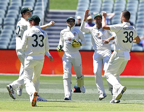 Australia's Josh Hazlewood, right, celebrates taking the wicket of India's India's Ajinkya Rahane on the third day of their cricket test match at the Adelaide Oval. (Photo | AP)