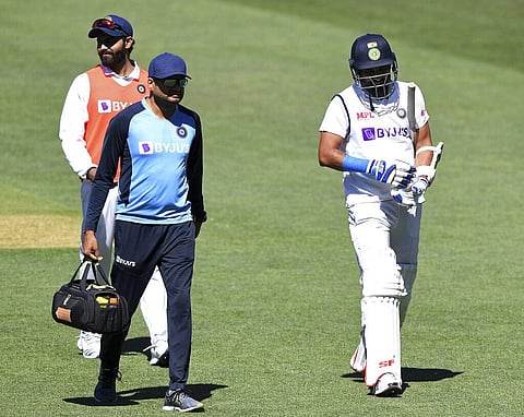 India's Mohammed Shami, right, retires hurt after he was struck on the forearm on the third day of their cricket test match against Australia at the Adelaide Oval. (Photo | AP)