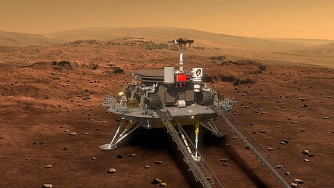 This artist's rendering provided to China's Xinhua News Agency shows a concept design for the Chinese Mars 2020 rover and lander. (Photo | AP)