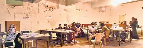 With not many turning up to cast their votes, polling staff sit idly at an election booth in the Old City of Hyderabad on Tuesday.| Vinay Madapu