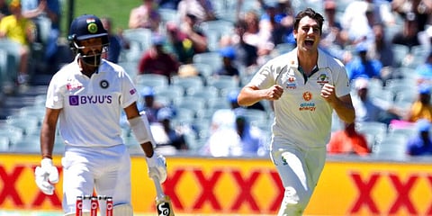 Australia's Pat Cummins celebrates the wicket of India's Cheteshwar Pujara on the thrid day of the Adelaide Test. (Photo | AP)