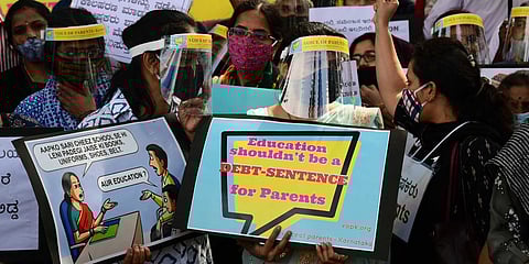 Parents gathered near Mysore Bank Circle to protest against schools that have threatened to stop classes and demanding full fees. (Photo| Shriram BN, EPS)