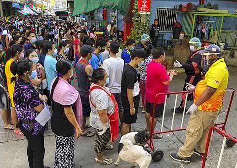 People stand in lines to get COVID-19 tests in Samut Sakhon, South of Bangkok, Thailand, Sunday, Dec. 20, 2020. (Photo | AP)