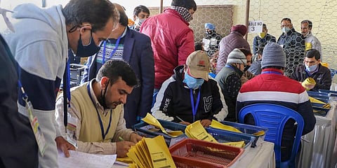Counting of votes for the recently concluded District Development Council elections in progress at a centre in Jammu Tuesday Dec. 22 2020. (Photo | PTI)