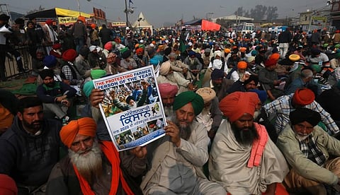 Farmers during the ongoing protest against the farm laws at Singhu Border in New Delhi on Tuesday. (Photo | Shekhar Yadav/EPS)