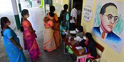 Voters queue up at a polling booth to exercise their franchise in Nelamangala, Bengaluru. (Photo| Shriram BN, EPS)
