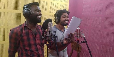 Shivakumar and Leon Peter Varghese recording the audio drama.