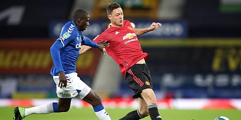 Manchester United's Nemanja Matic and Everton's Abdoulaye Doucoure (L) contest for the ball during the English League Cup quarterfinal match at Goodison Park, Liverpool. (Photo | AP)
