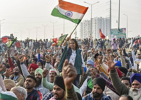 Farmers raise slogans during their protest against the Center's new farm laws at Ghazipur border in New Delhi Thursday Dec. 24 2020. (Photo | PTI)