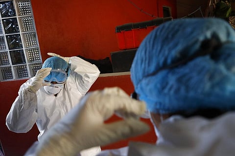 Doctors put on protective gear against COVID-19. (File Photo | AP)