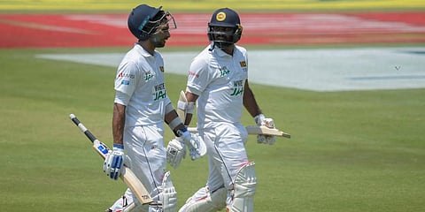 Sri Lanka's Dasun Shanaka (L)Â and Lahiru Kumara walk on the field after South Africa bowled them out for 376 runs, on day two of the first Test at Super Sport Park Stadium in Pretoria. (Photo | AP)