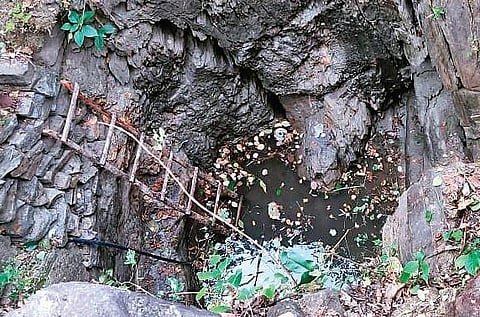 Chada Pahan stands near the well he dug up single-handedly in Kojdong village in Jharkhand’s Khunti district | Express
