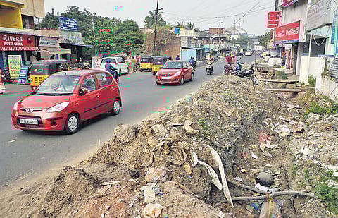 Unfinished work on the stormwater drains beside Medavakkam High Road, near Vanuvampet, poses a threat to motorists and pedestrians | Ashwin Prasath