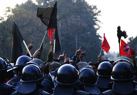Nepalese students affiliated with Nepal Student Union chant slogans against prime minister Khadga Prasad Oli during a protest in Kathmandu. (Photo | AP)