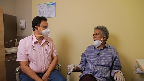 Dr. Manoj Nair, consultant interventional radiologist of Aster Medcity, Kochi, with the patient. (Photo | EPS)