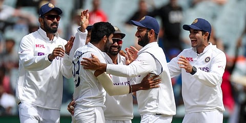 India's Jasprit Bumrah, second left, is congratulated by teammates after dismissing Australia's Steve Smith during play on day three of the second Test at the MCG. (Photo | AP)