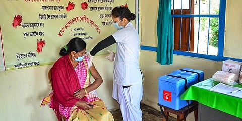 A medic demonstrates administration of COVAXIN COVID-19 vaccine to a health worker during its trials at the Urban Primary Health Centre in Assam. (Photo | PTI)