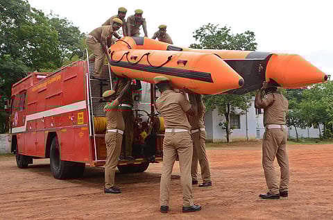 Firemen of Tirunelveli Palayamkottai take a rescue boat for deployment (Photo | EPS/ V. Karthikalagu)