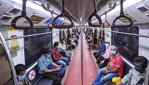 Commuters travel in a metro as Kolkata Metro services resume in a graded manner amid the ongoing coronavirus pandemic in Kolkata. (File Photo | PTI)