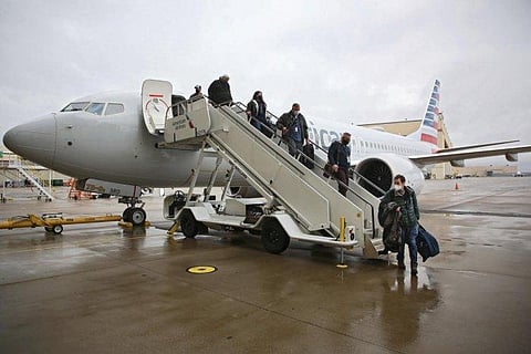 Journalists and American Airlines employees disembark a Boeing 737 Max at the American Airlines Tulsa maintenance facility Wednesday, Dec. 2, 2020 in Tulsa, Okla. (Photo | AP)