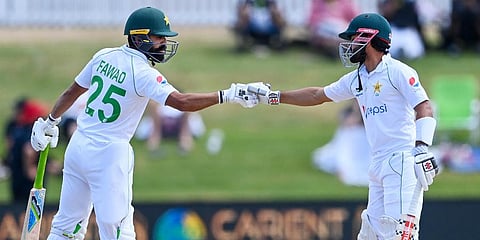Pakistan's Fawad Alam (L) and his captain Mohammad Rizwan celebrate their 150 partnership during play on the final day of the first Test against New Zealand at Bay Oval. (Photo | AP)