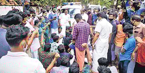 Tension prevailed near the house of Rajan and Ambili for more than three hours after local residents staged a protest by blocking the ambulance carrying her body, demanding justice. | Express