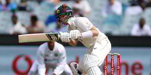 Australia's Steve Smith attempts to avoid a bouncer while batting during play on day three of the second Test against India at the Melbourne Cricket Ground. (Photo | AP)