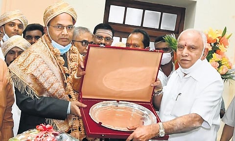 Chief Minister B S Yediyurappa felicitating Chief Secretary T M Vijay Bhaskar at Vidhana Soudha in Bengaluru on Monday | Express