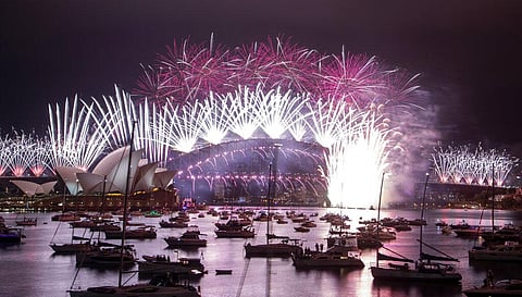 Fireworks explode over the Sydney Opera House and Harbour Bridge as New Year celebrations begin in Sydney, Australia. (Photo | AP)
