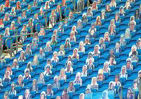 Cardboard cutout photograph of supporters was a common sight in football stadiums as matches were played behind closed doors | AFP