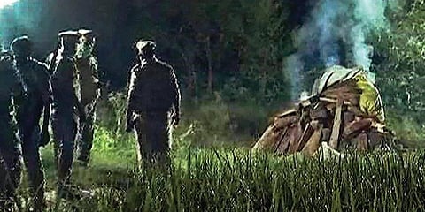 Police cremate the body of the gang-rape victim in the middle of the night in Hathras district in UP | PTI