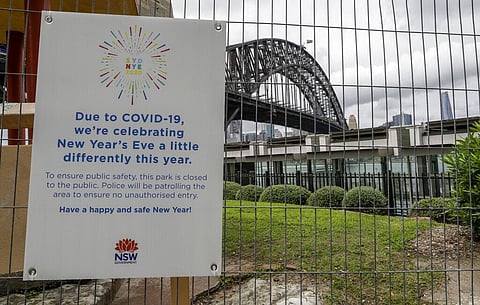 A signs adorns a security fence near the harbour foreshore ahead of New Years Eve in Sydney, Australia, Thursday, Dec. 31, 2020. (Photo | AP)